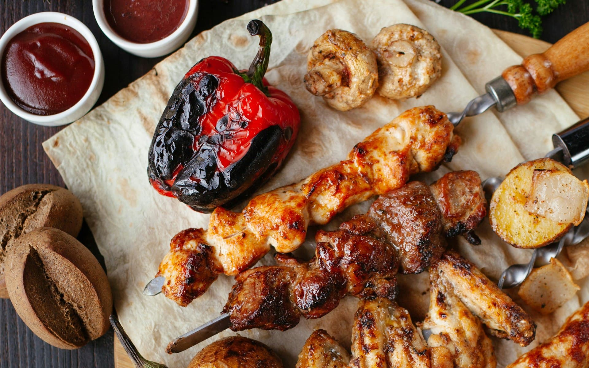 A spread of grilled tandoori skewers and vegetables